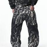 “Relationship“ Printed Splashed Ink Washed Jeans in Black