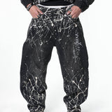 “Relationship“ Printed Splashed Ink Washed Jeans in Black