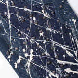 “Relationship“ Printed Splashed Ink Washed Jeans in Blue